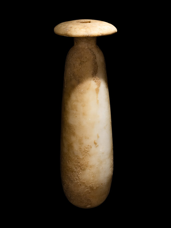 An Egyptian Marble Alabastron
Height 7 inches (18 cm).
