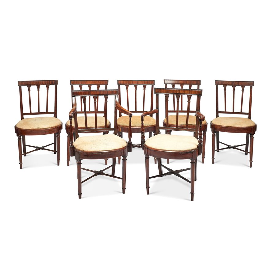 A set of seven George III mahogany dining chairs including a pair of open armchairs