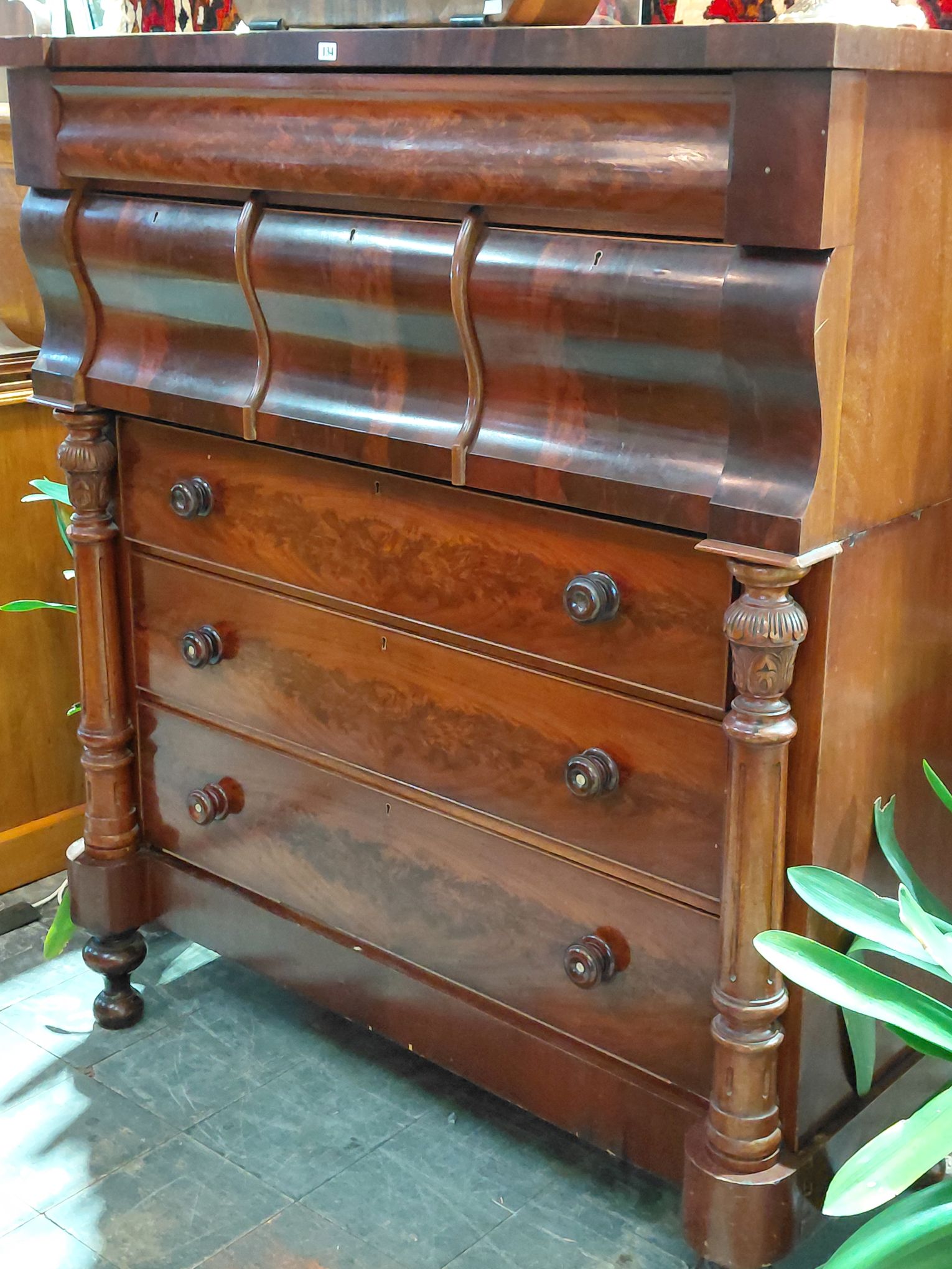 134 · A MAHOGANY CHEST OF DRAWERS