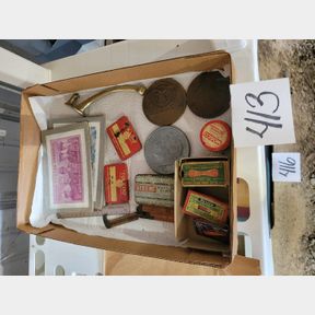 Assorted postcard puzzles, large coins, and other product containers
