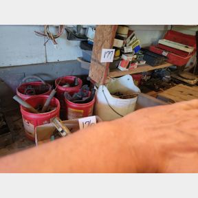 Corner of misc. nuts, bolts and other garage items