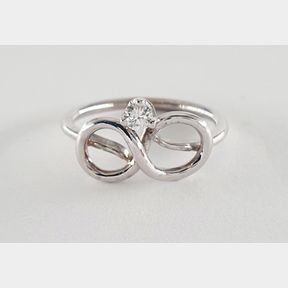 18CTWHITE GOLD INFINTY RING WITH 0.100CT DIAMOND COLOUR GH CLARITY VS - 51929/3382