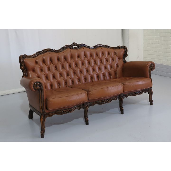 CARVED AND BUTTON UPHOLSTERED SETTEE