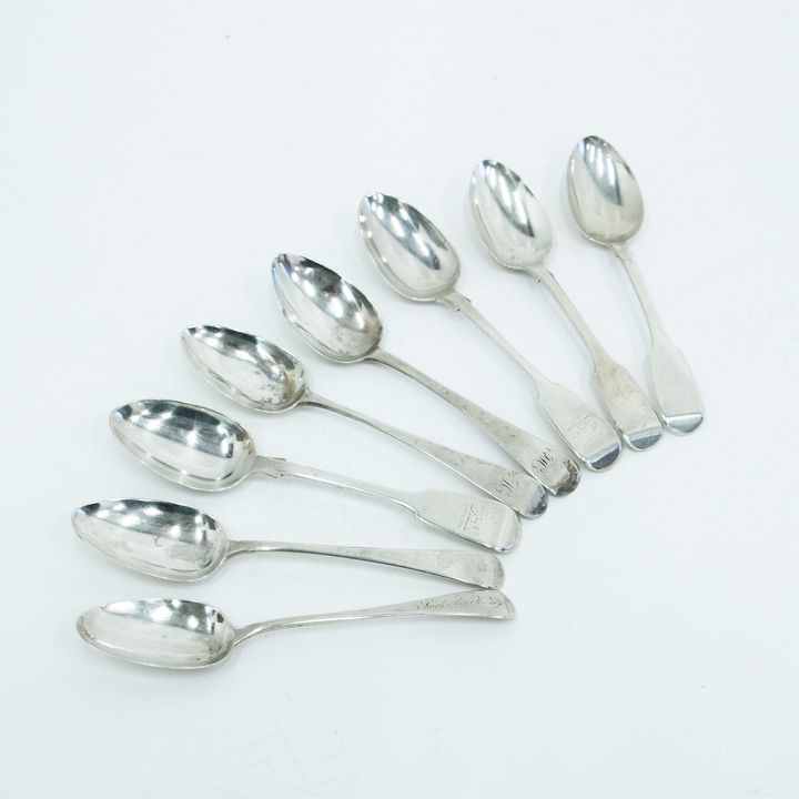 Eight Georgian and Victorian silver dessert spoons