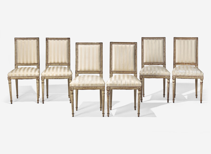 A Set of Six Louis XVI Cream-Painted and Parcel Gilt Dining Chairs