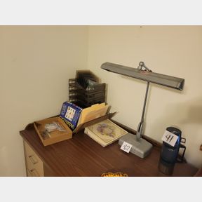 large vintage desk lamp and assorted office supplies