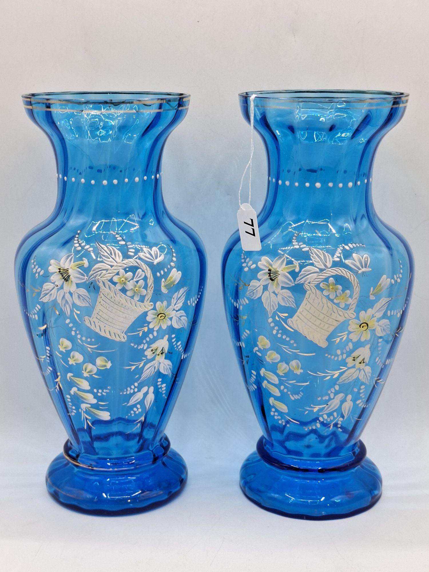 77 · A PAIR OF VICTORIAN BLUE GLASS VASES