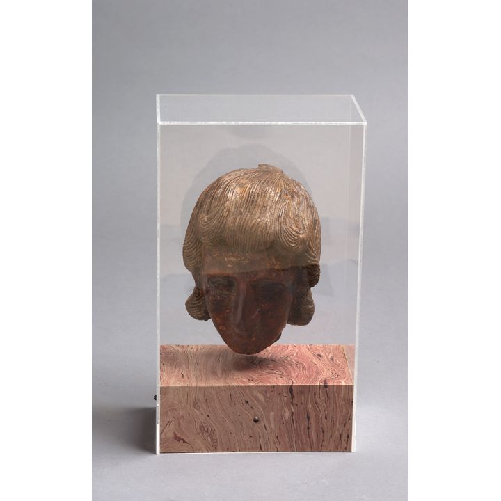 A carved classical wooden head of a lady