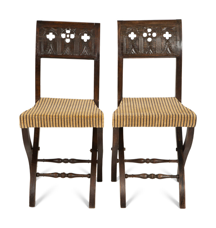 A Pair of Continental Carved Oak 'Gothic' Folding Chairs