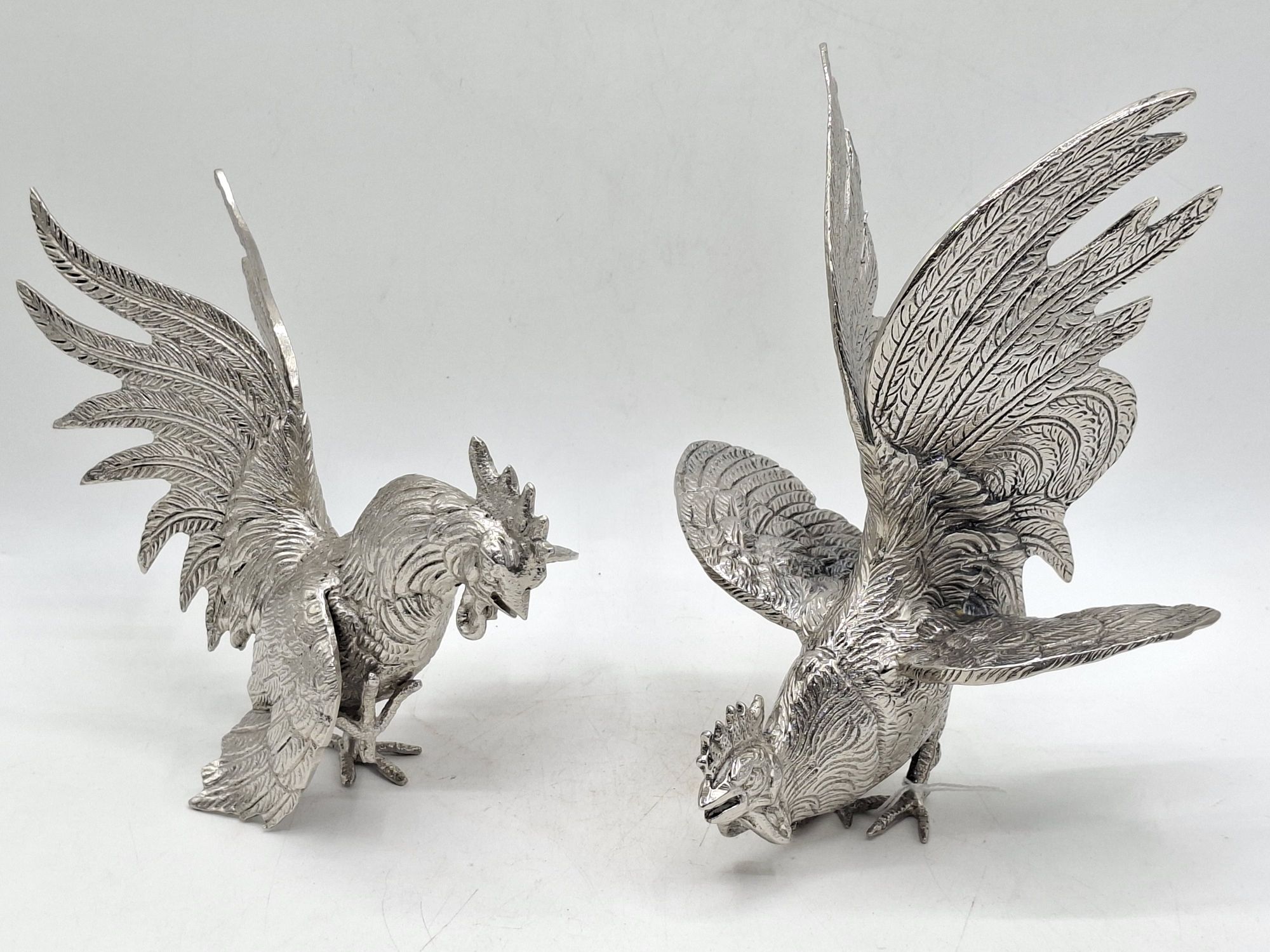 134 · PAIR OF FIGHTING COCKERELS