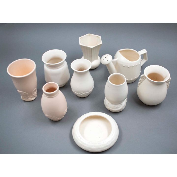 Crown Lynn Potteries - A collection of nine small slip-cast ceramics