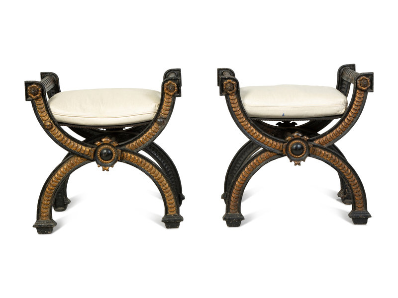 A Pair of Continental Cast Iron and Parcel Gilt Curule-form Tabourets
Height 23 1/2 x width 23 x depth 16 inches.