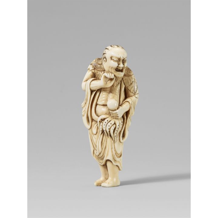 An ivory netsuke of a sennin with an octopus. 18th century
