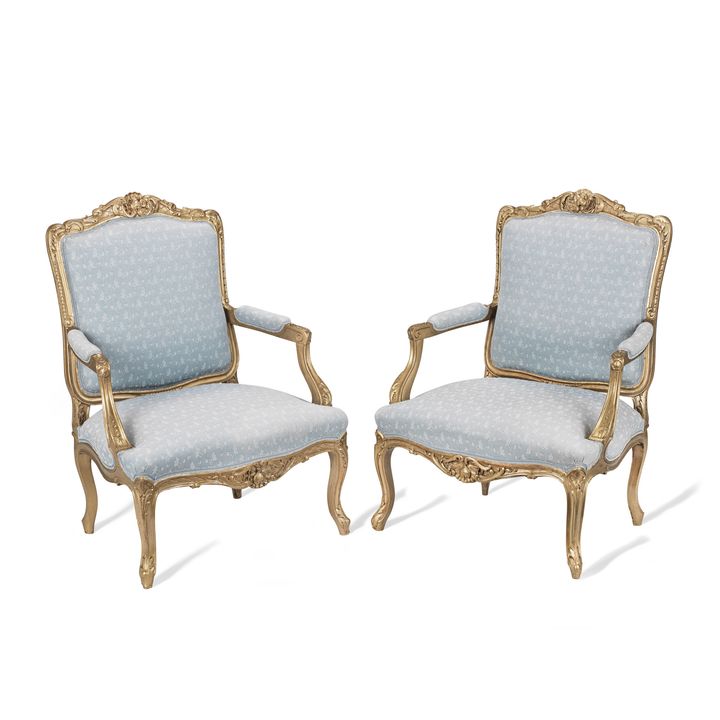 A pair of 20th century Louis XV style giltwood fauteuils
