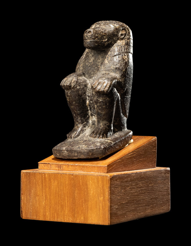 An Egyptian Serpentine Baboon
Height 2 3/4 inches (7 cm).