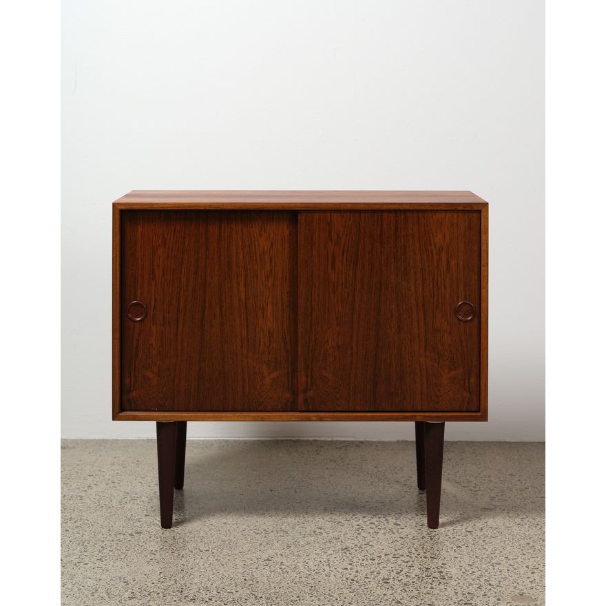 A dark-stained Danish two door teak cabinet
