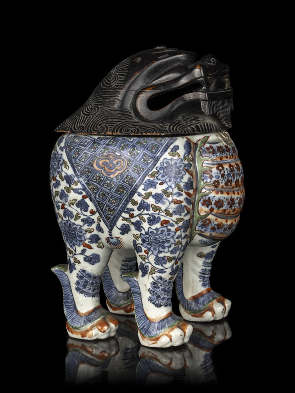 A Chinese Copper Red and Underglaze Blue Porcelain Mythical-Beast Form Incense Burner