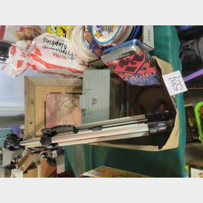 Camera tripod, hearing protection and bird feeder