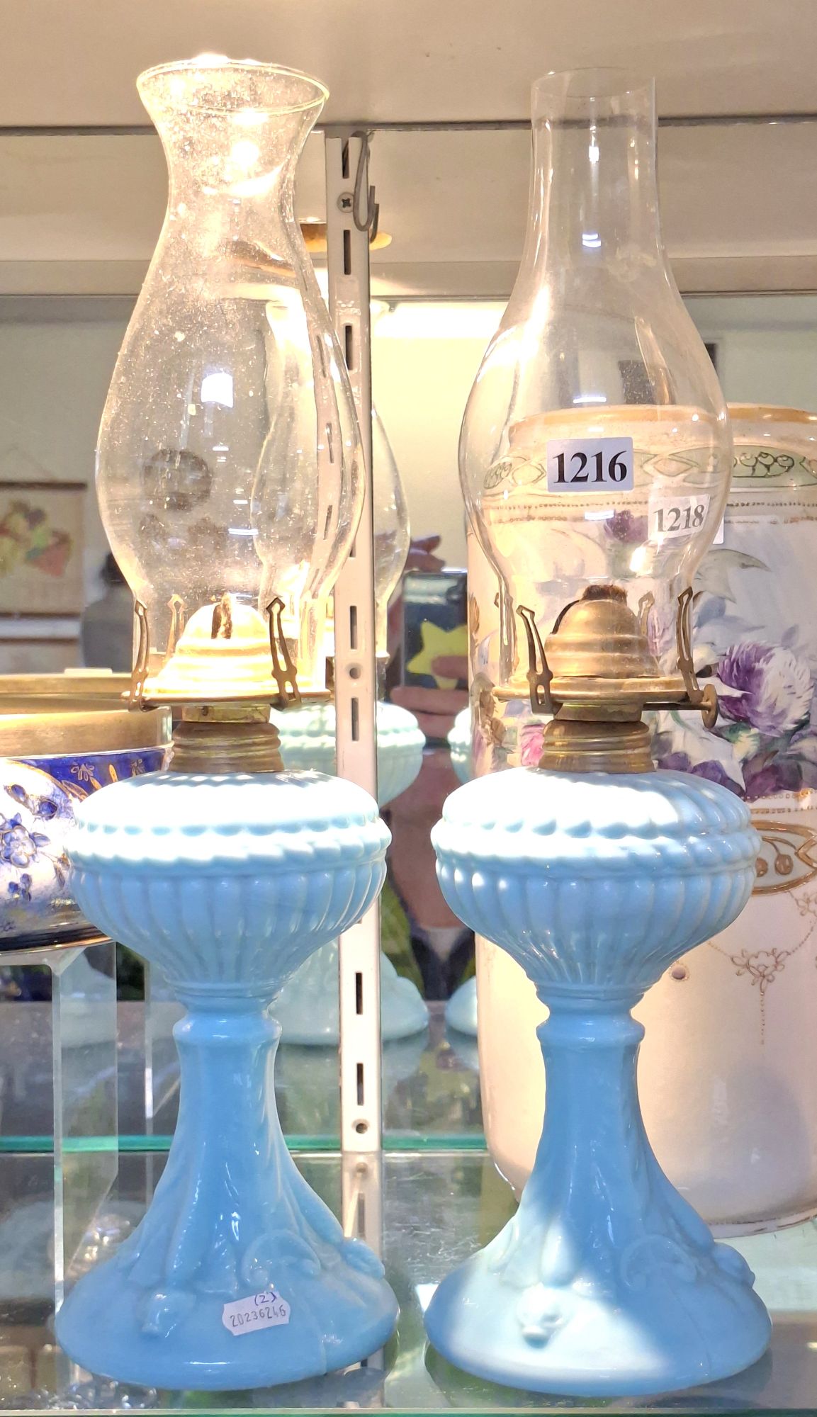1216 · A PAIR OF BLUE GLASS OIL LAMPS