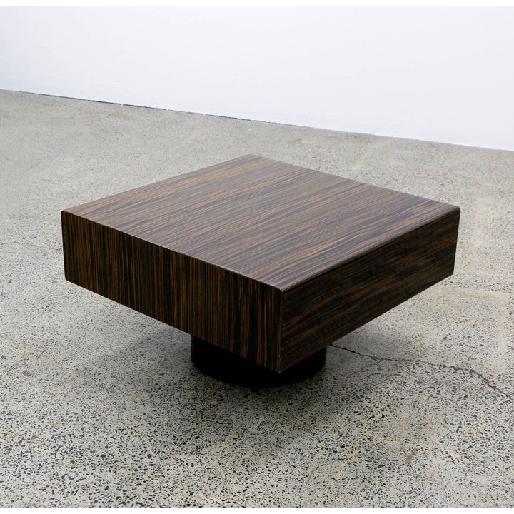 A heavily lacquered Brazilian rosewood coffee table
