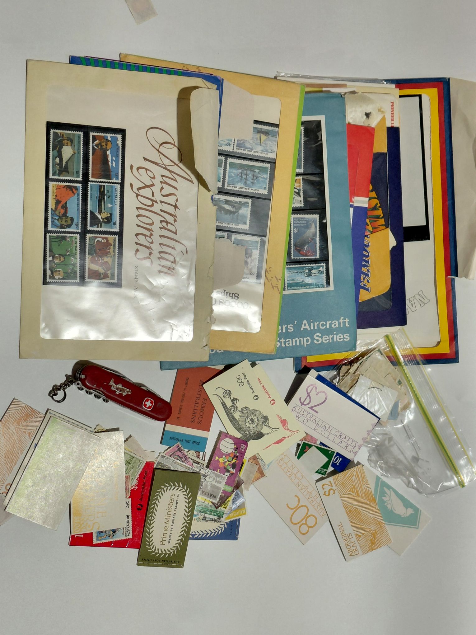 Swiss Army Knife And Stamp Collection