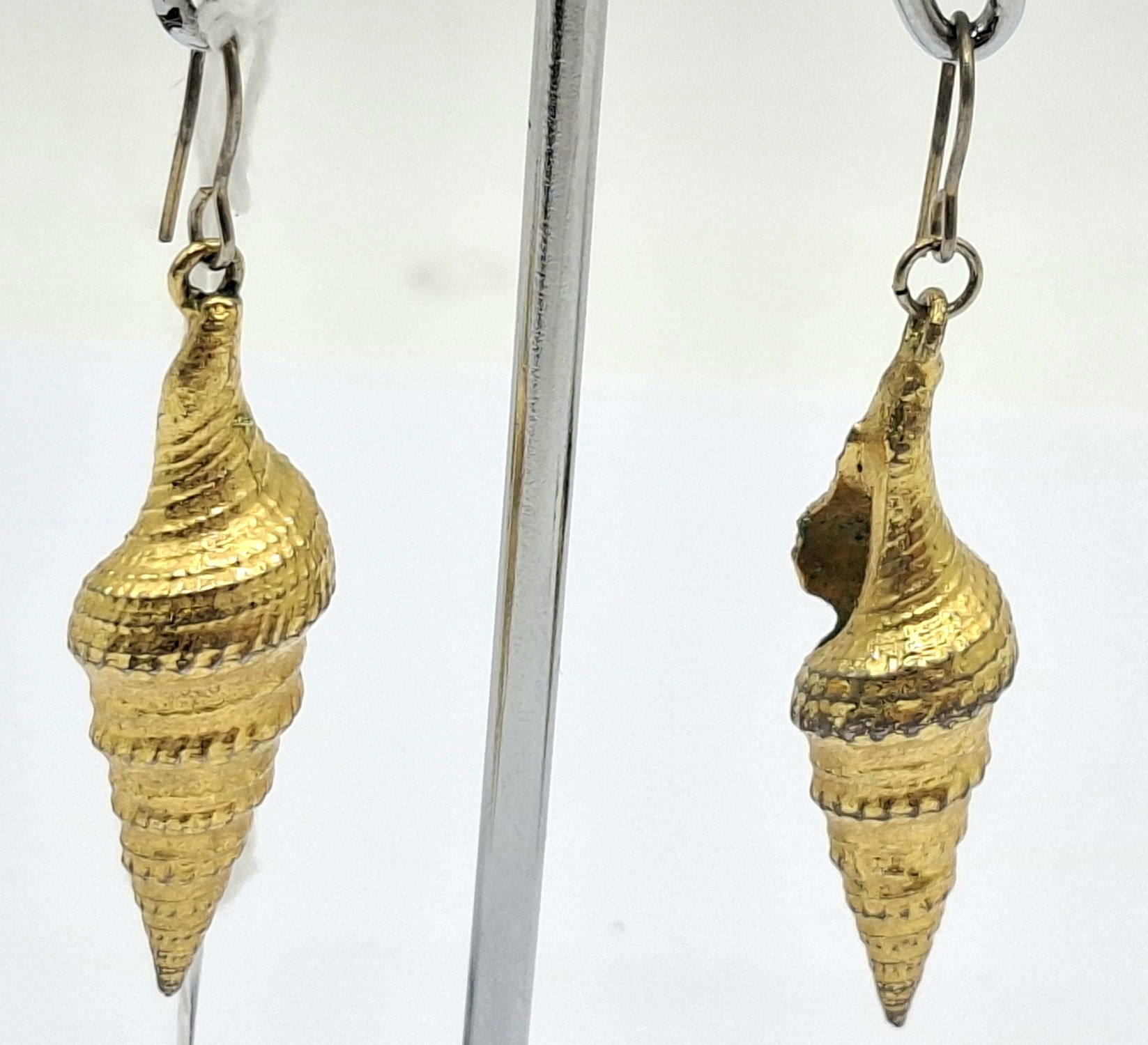 A Pair Of Cornucopia Shell Earrings