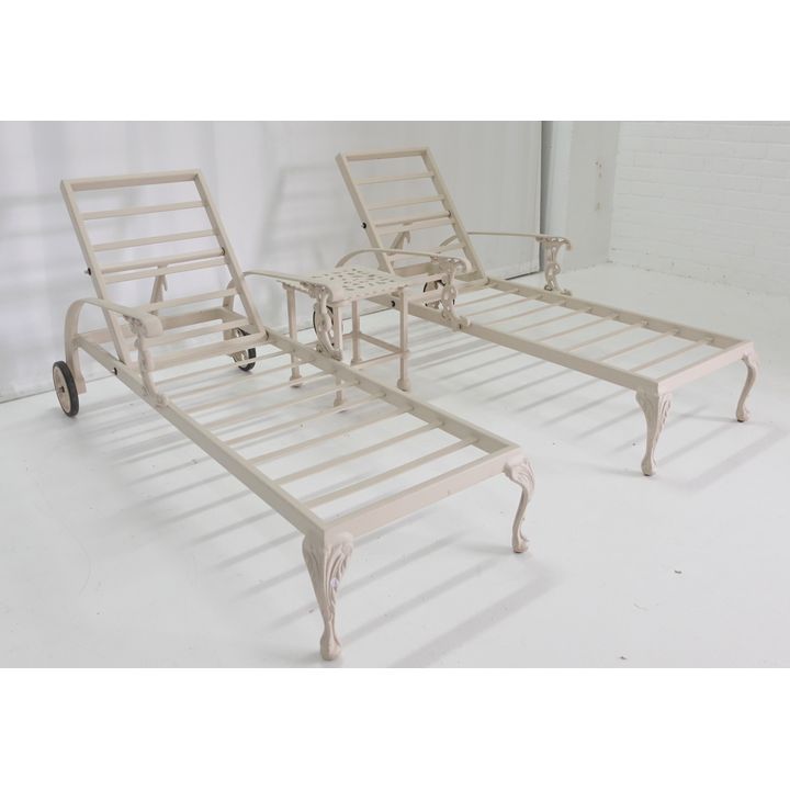 PAIR OF CAST ALUMINIUM SUN LOUNGERS AND A TABLE