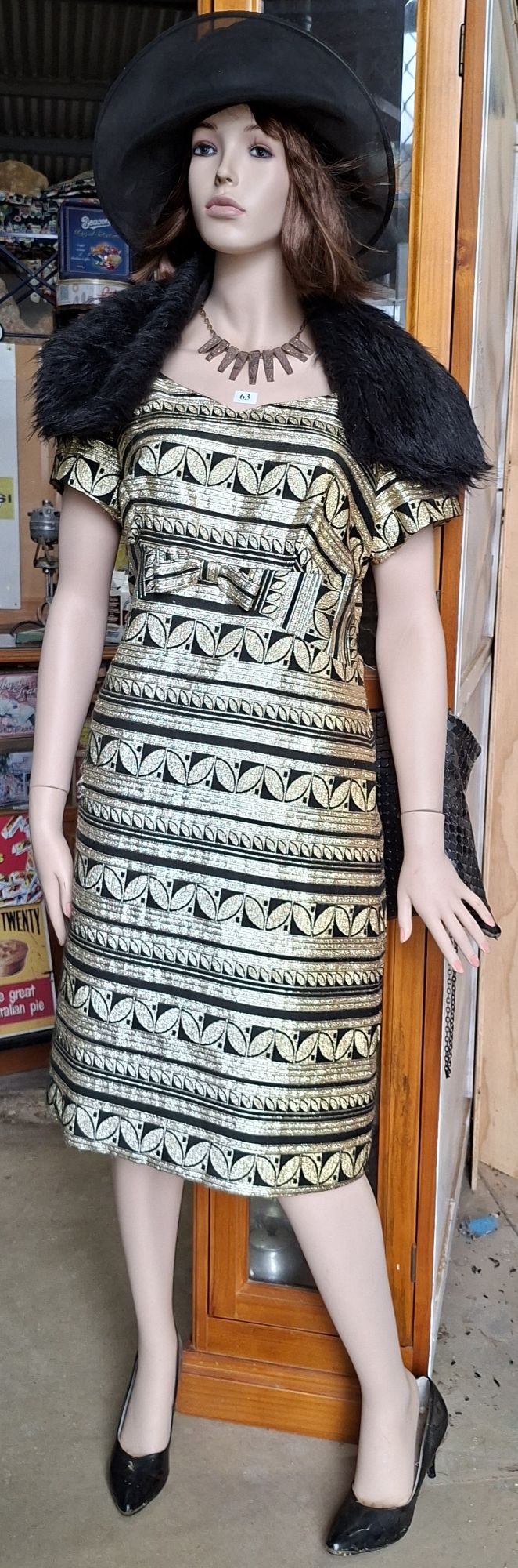 63 · MANNEQUIN AND CLOTHING