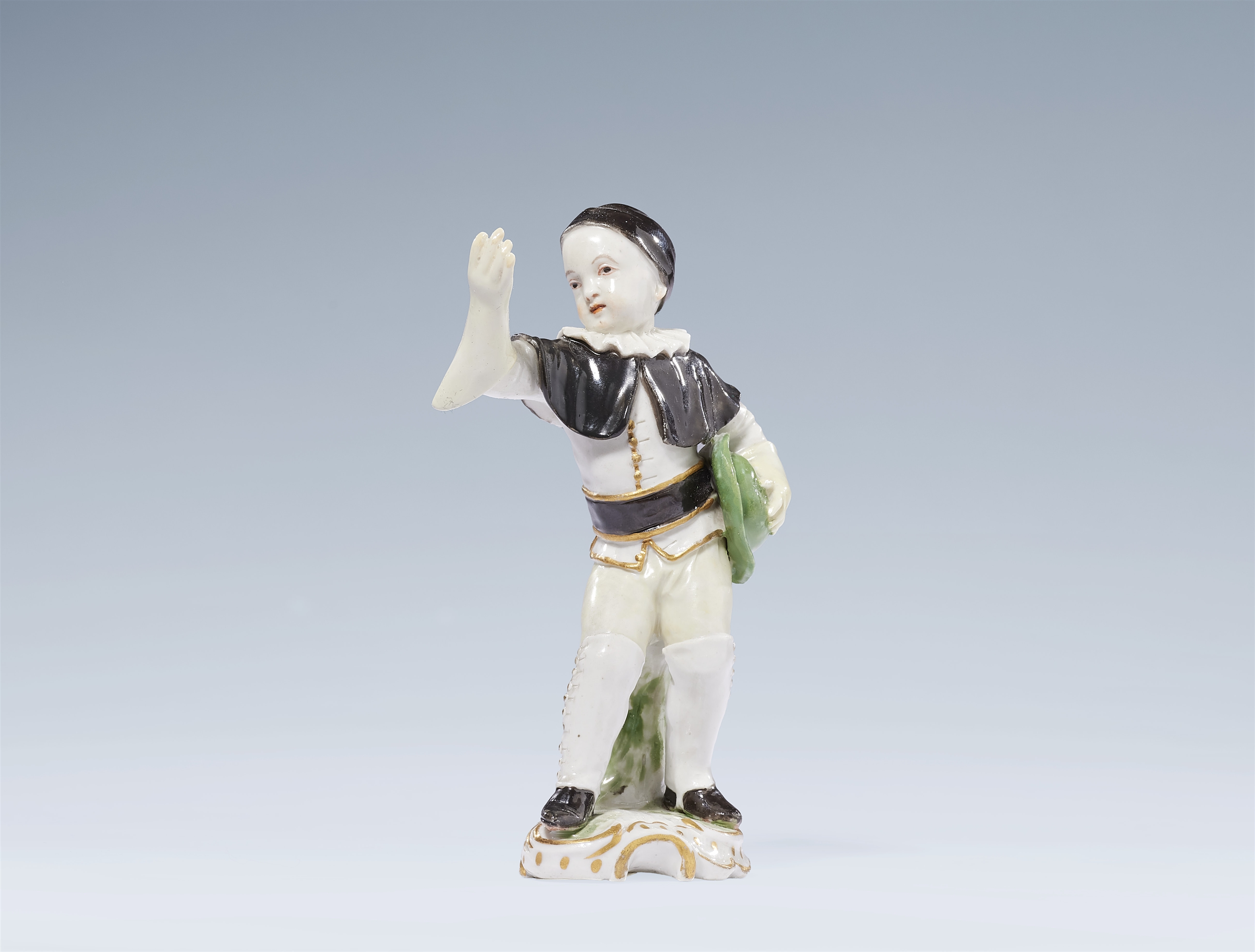 A Ludwigsburg porcelain figure of Scapin or Crispin from the children's Commedia dell'arte series by Johann Christoph Haselmeyer