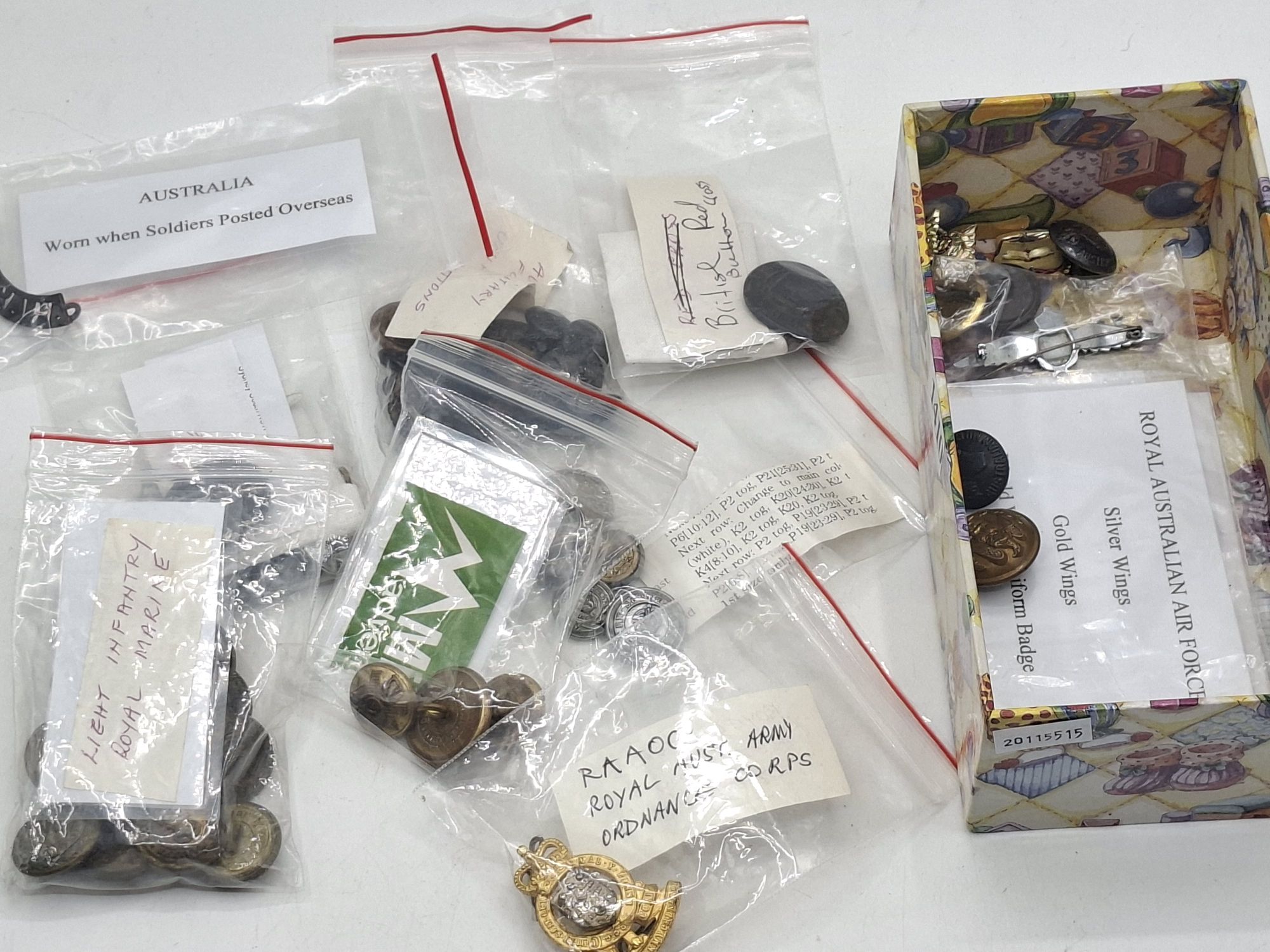 COLLECTION OF MILITARY BUTTONS AND BADGES