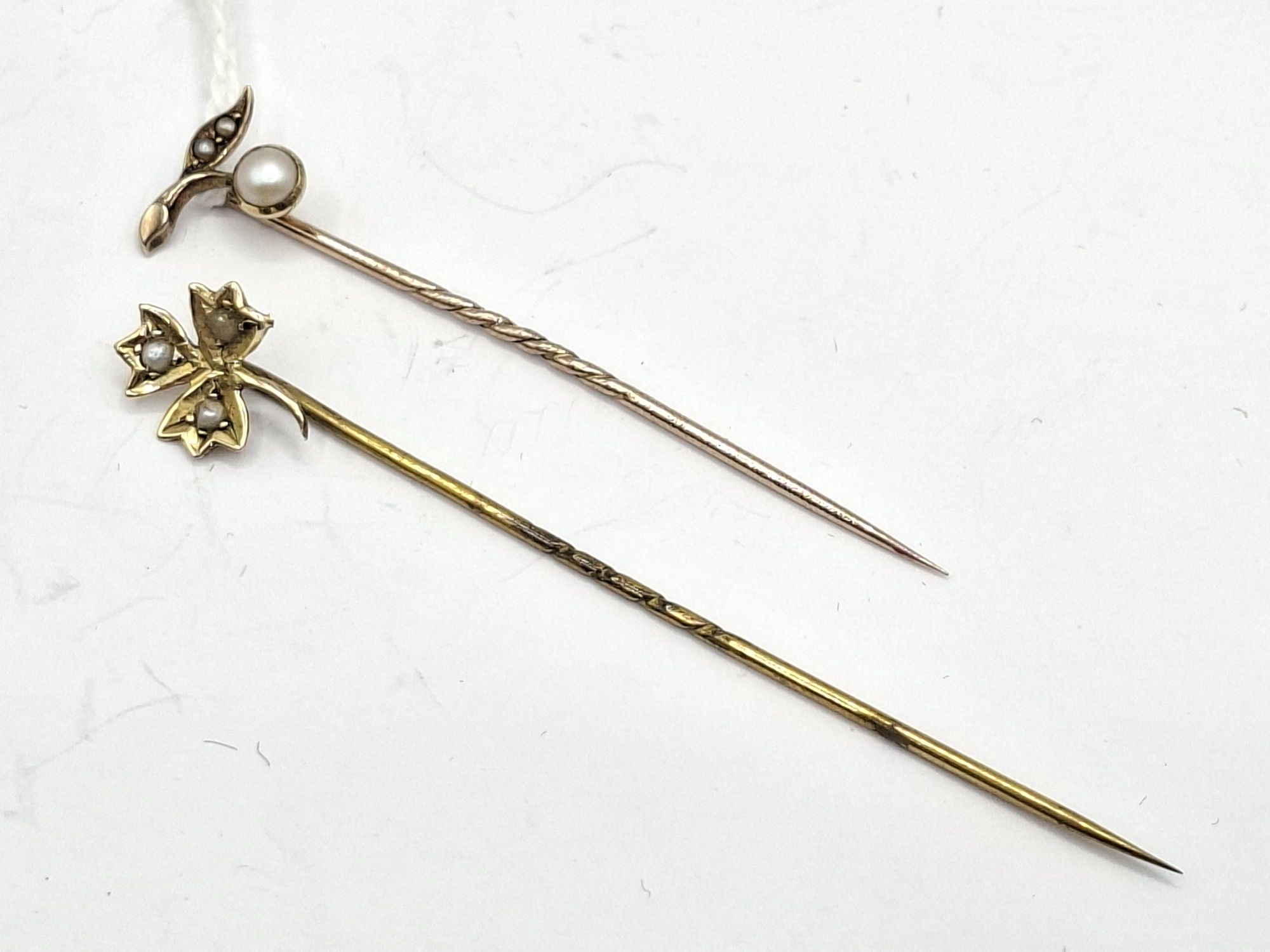 1074 · TWO ANTIQUE STICK PINS