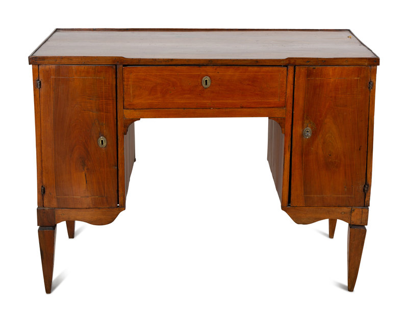An Italian Fruitwood Desk
Height 32 1/2 x width 43 1/2 x depth 20 1/2 inches.