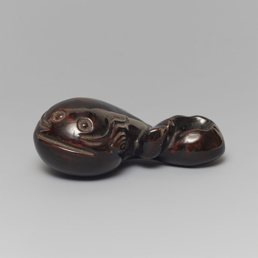 A rare large lacquered wood netsuke of a catfish. Late 19th century