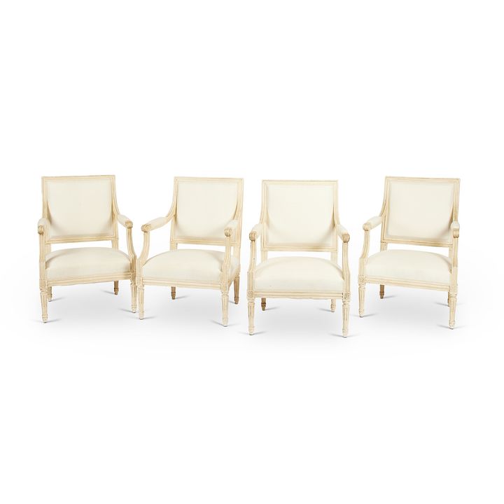 A set of four early 20th century Louis XVI style white painted fauteuils