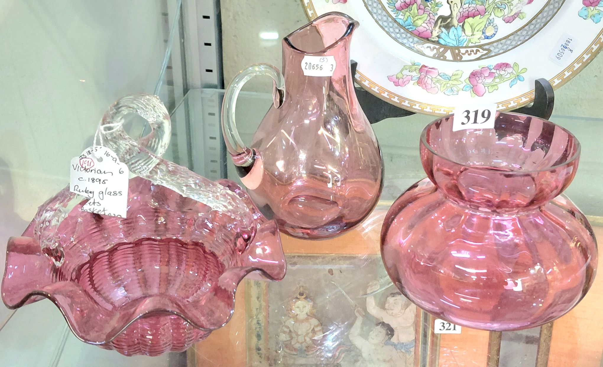 319 · THREE PIECES OF CRANBERRY GLASS