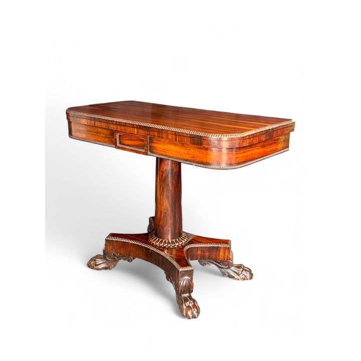 A Regency goncalo alves carved card table attributed to Gillows