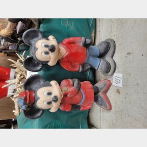 Pair of concrete Mickey and Minnie Mouse figures