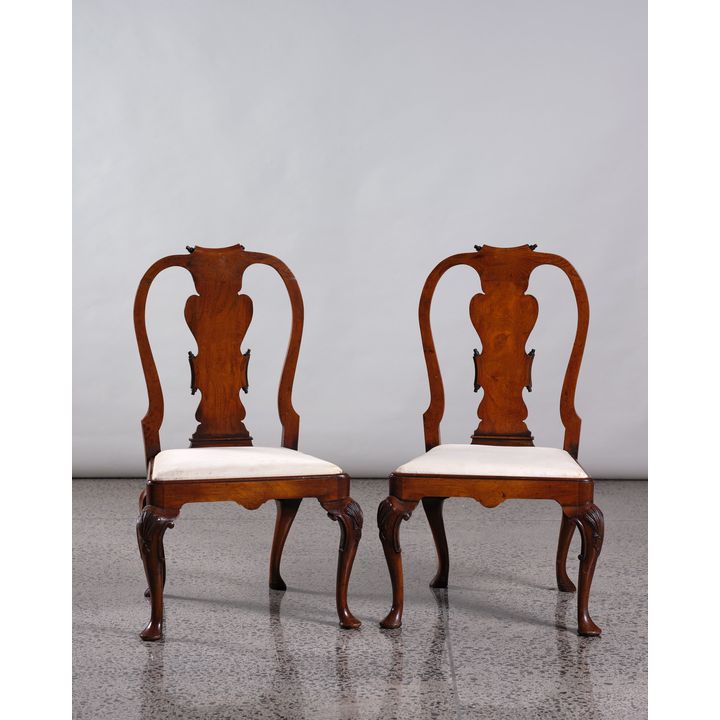 A pair of walnut Queen Anne style chairs