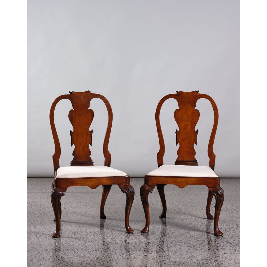 A pair of walnut Queen Anne style chairs