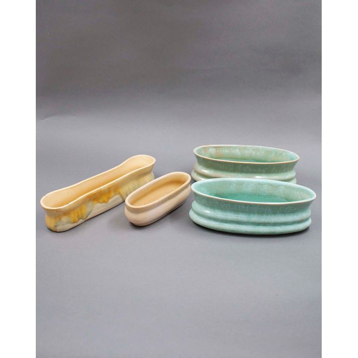 New Zealand Pottery - A collection of four colour-glazed trough vases