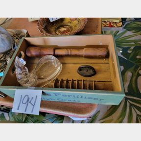 Antique Iron paper weight, wood kitchen tools and cat dish in Farmer Fertilizer crate