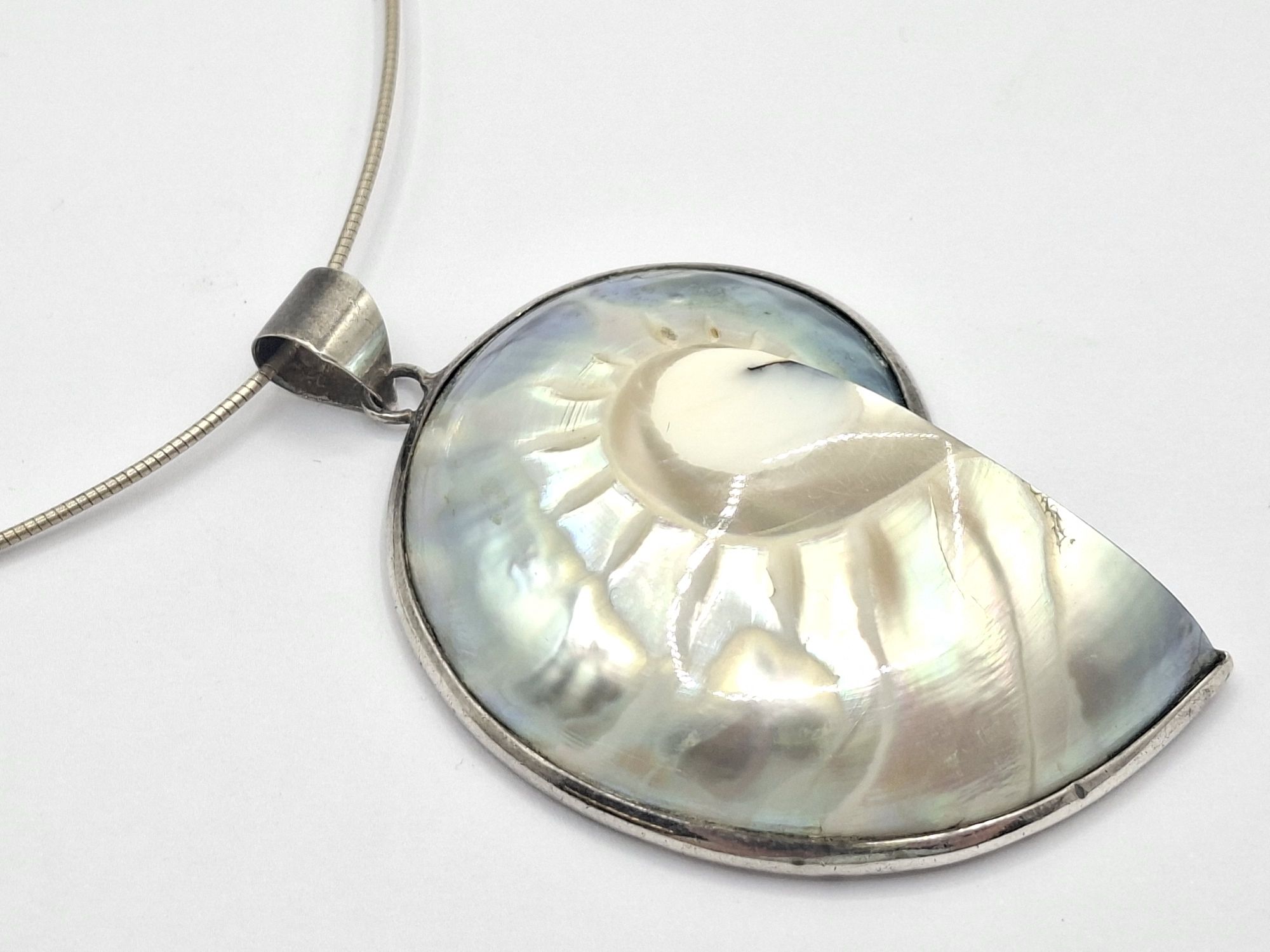 1100 · SILVER FOSSIL SHELL PENDANT