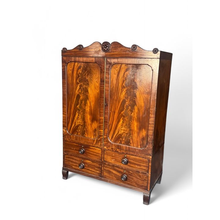 An unusual Regency mahogany dwarf linen press by John Taylor of Colchester (labelled)