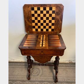 A LATE 19TH CENTURY WALNUT GAMES TABLE, the octagonal shaped burr walnut top opens to reveal an inlaid chess &