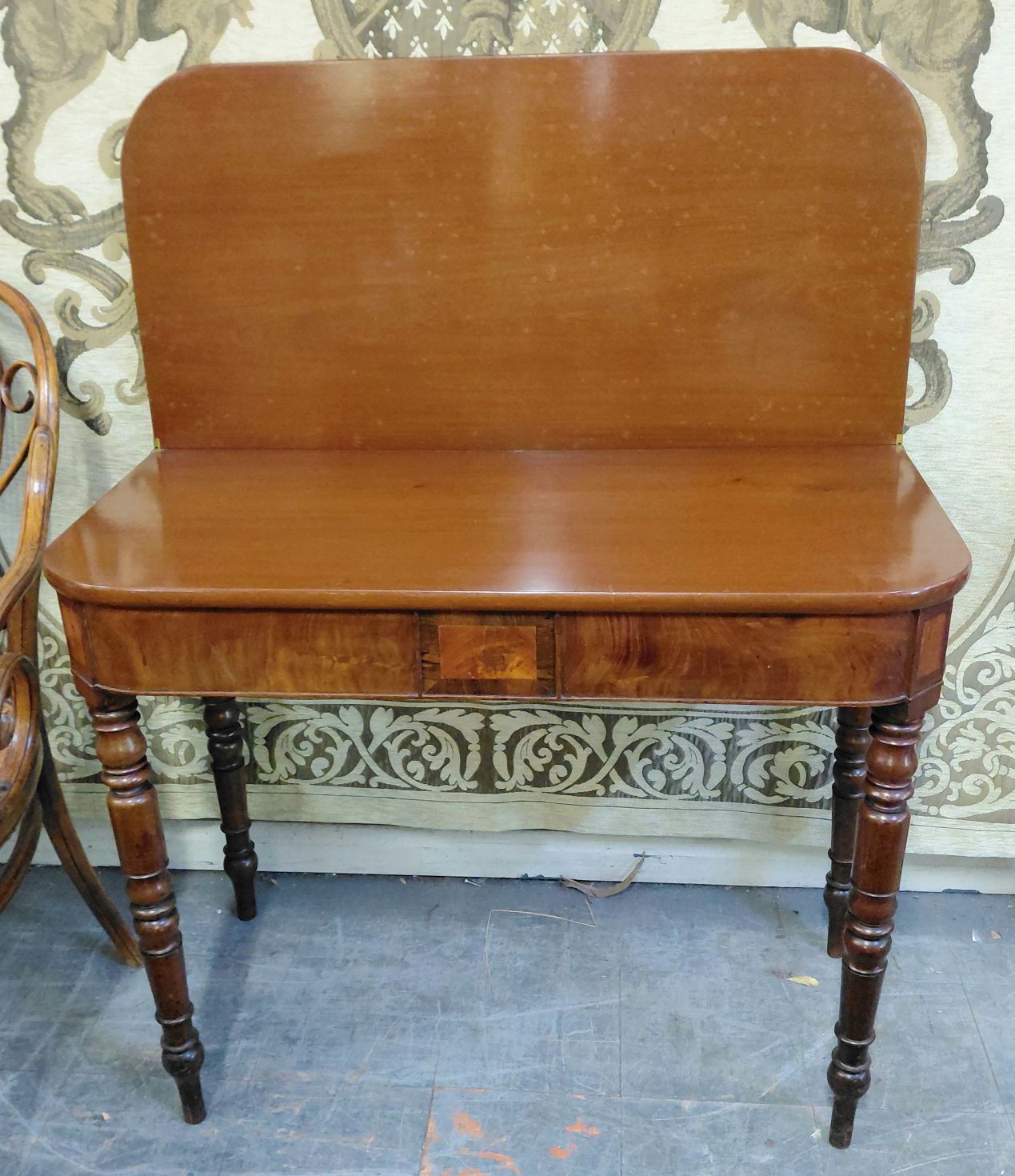 24 · A GEORGIAN FOLDING TEA TABLE