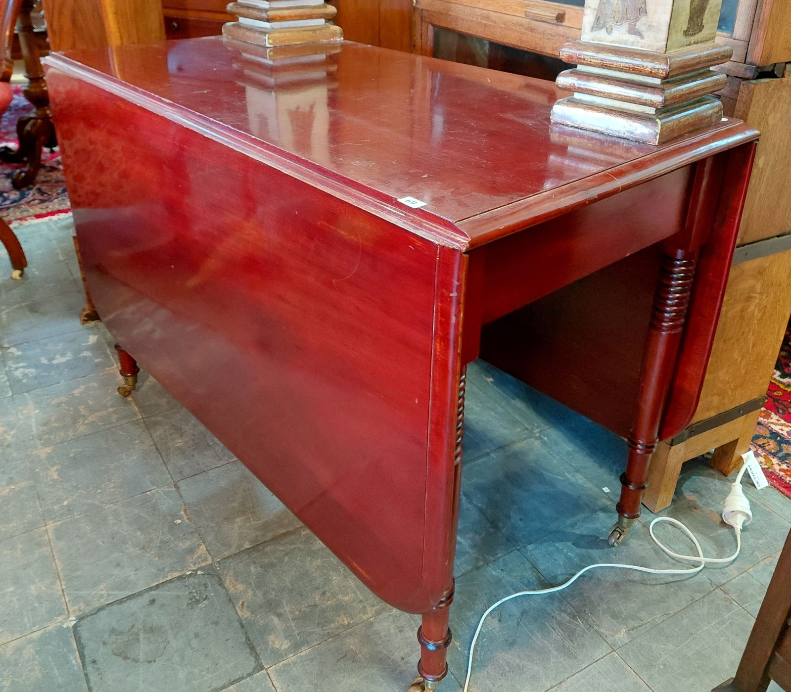 69 · MAHOGANY DROP-SIDE TABLE