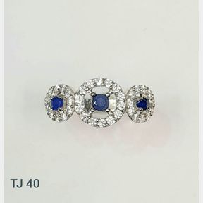 STERLING SILVER TRILOGY RING WITH BLUE AND WHITE CUBICS