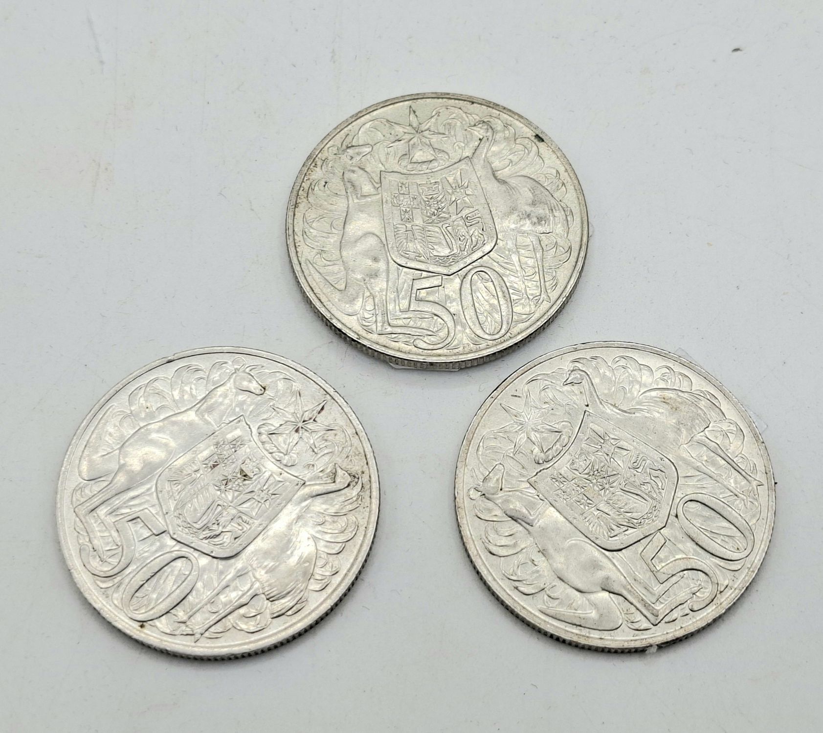 THREE ROUND AUSTRALIAN 50C PIECES