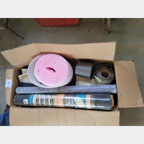 Roll of weed barrier, foam packing and roof tin insulation