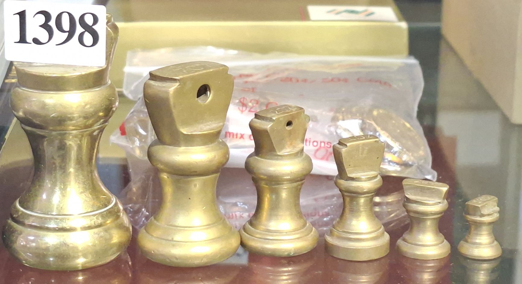 COLLECTION OF GRADUATED BRASS WEIGHTS